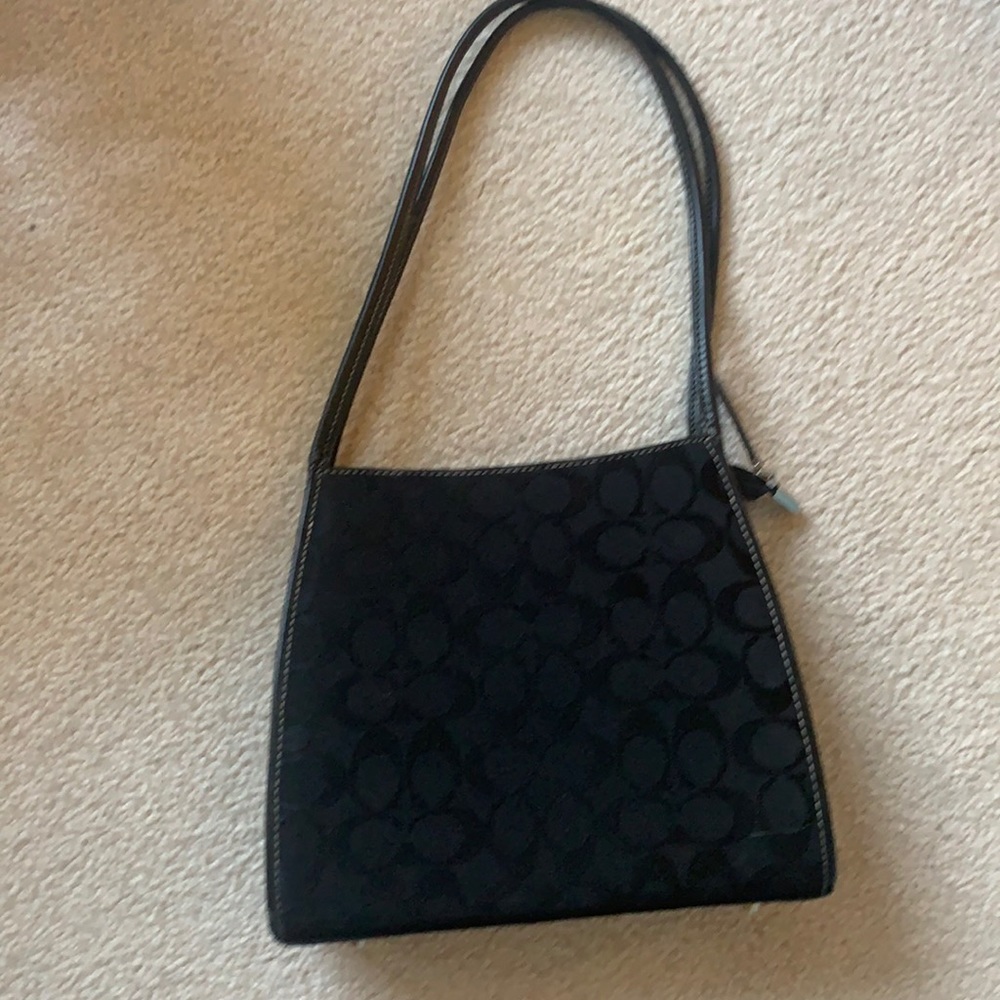Black coach purse. Signature C